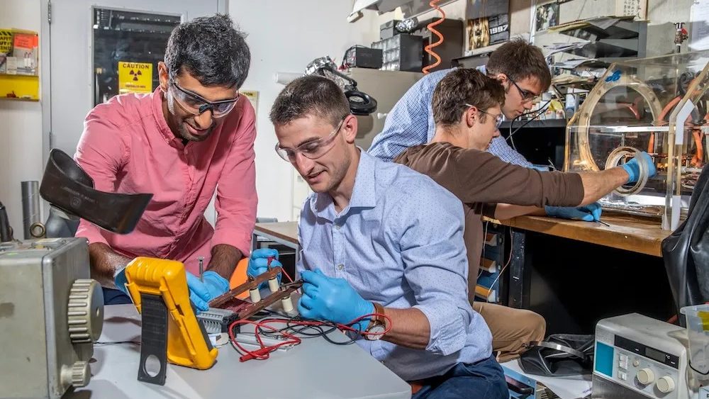 Four scientists working in a lab