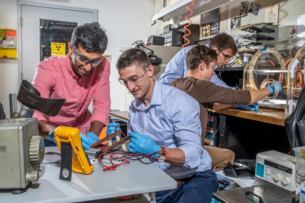 Four scientists working in a lab